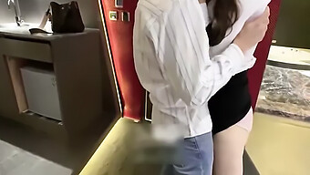 Asian Female Coworker Discovers A Man'S Impressive Member And Entices Him With Kisses And Sexual Advances